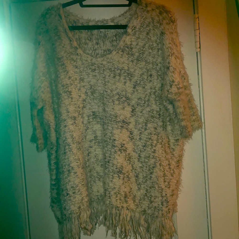 Off white sweater with some light mix colors.